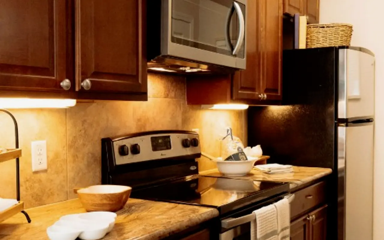 Stylish Modern Kitchen A modern kitchen with wooden cabinets, stainless steel appliances, and a sleek countertop.