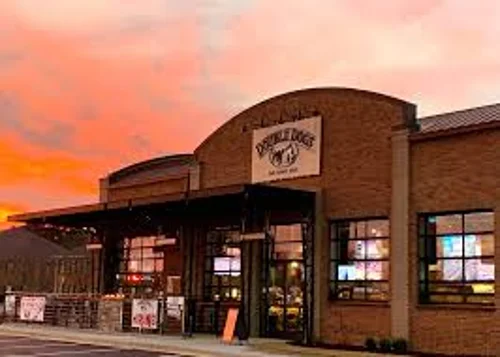 Exterior view of a diner building during sunset with vibrant sky colors.
