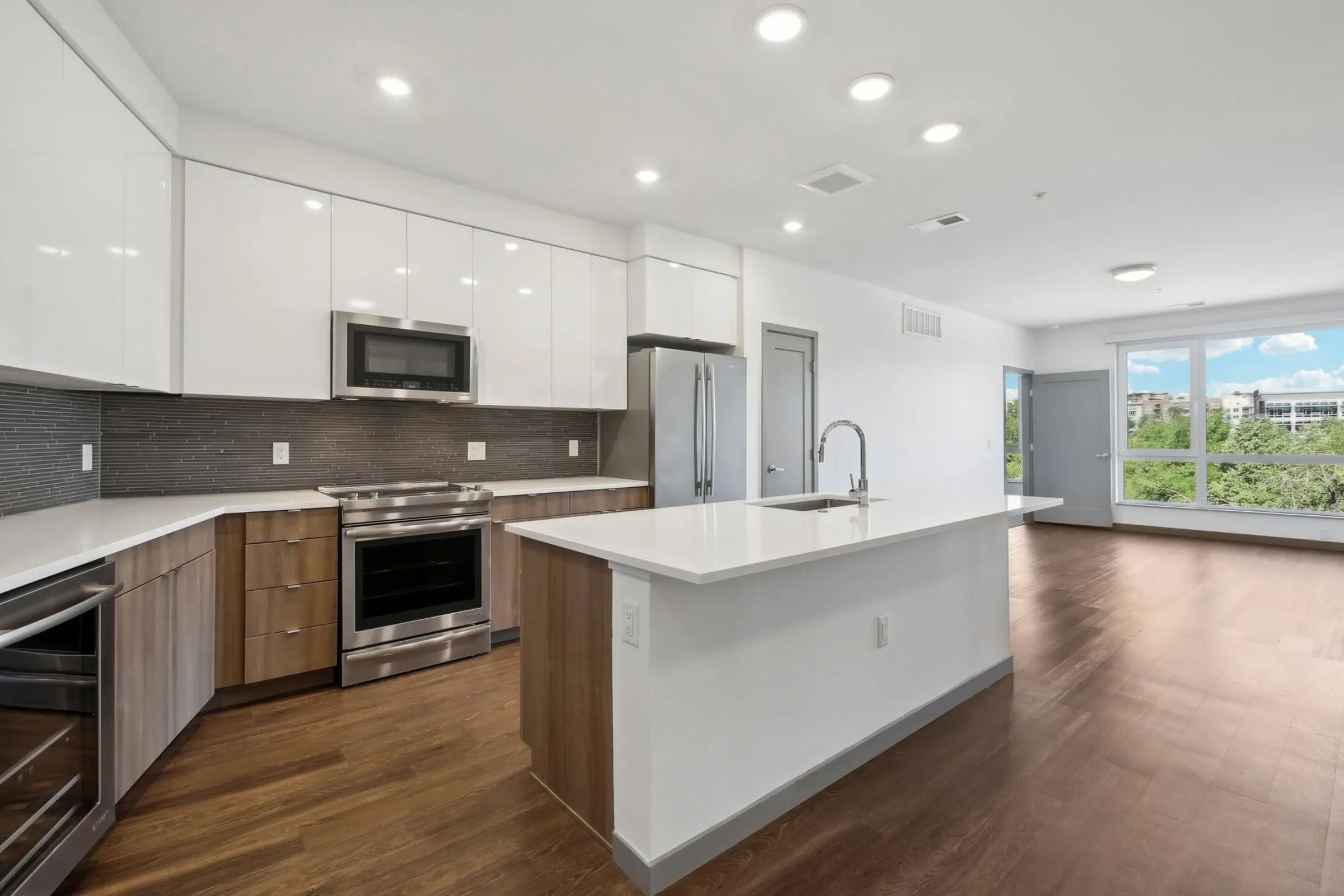 Stylish Modern Kitchen Overview A modern kitchen with sleek cabinetry, stainless steel appliances, and a large island.