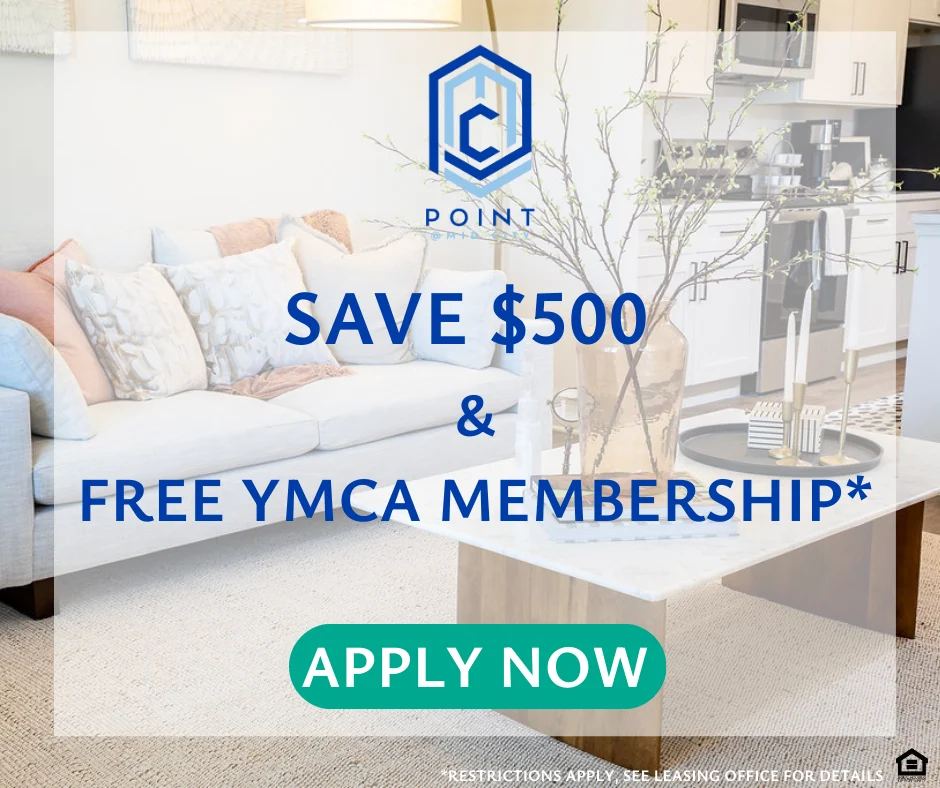 Promotional Offer for Apartment Leasing Promotional banner featuring a living room with a white couch, a coffee table, and a vase on it. Text overlays advertise savings and a free YMCA membership.