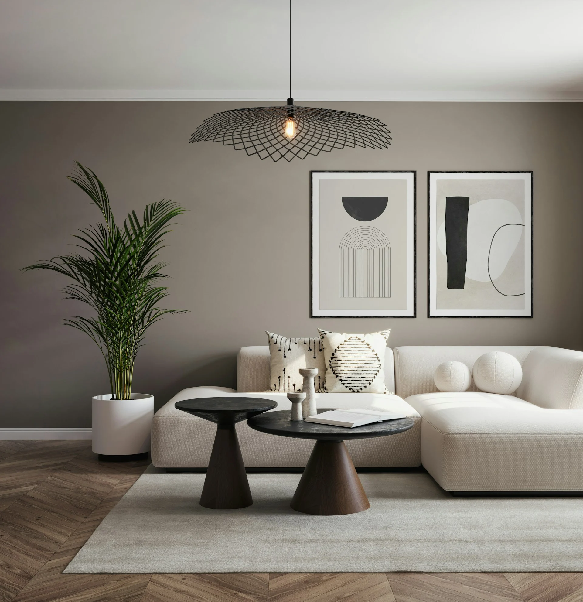 Chic Modern Living Room A modern living room featuring a light-colored sectional sofa, two black side tables, a potted plant, and abstract wall art.