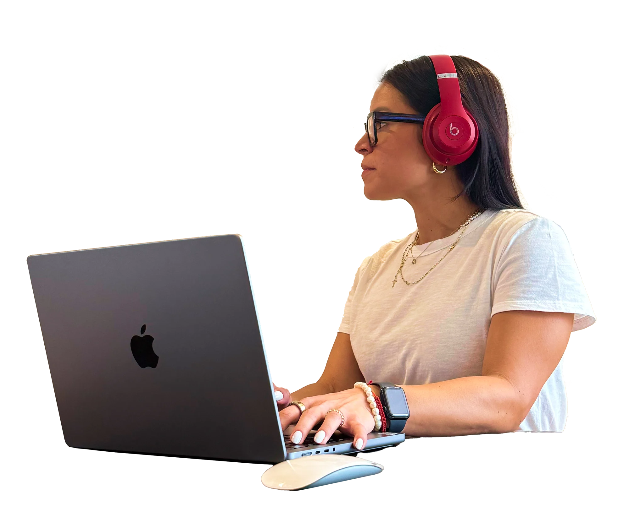 Remote Work Focus A woman wearing red headphones is sitting at a desk, focused on her laptop.