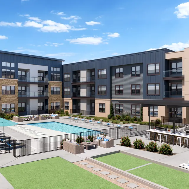 A modern apartment complex featuring a central pool area with lounge chairs, cabanas, and BBQ grills. Surrounding the pool are landscaped green areas and stylish buildings with a contemporary design.