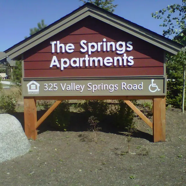 Sign for The Springs Apartments Sign for The Springs Apartments including address and accessibility symbol.