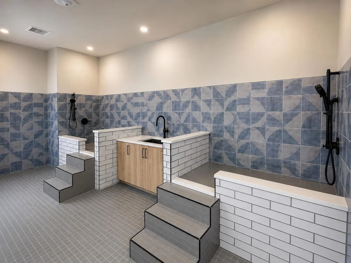 Communal Shower Room Design A modern communal shower area with tiled walls and multiple shower fixtures.