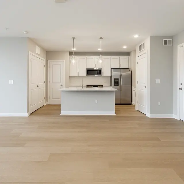 Modern Apartment Interior Spacious modern apartment interior with light wood flooring and a kitchen island.