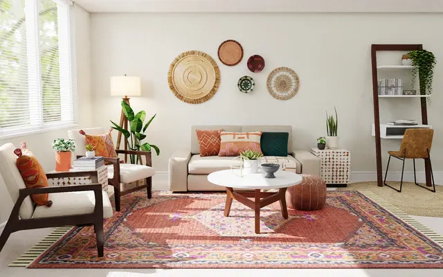 Modern Living Room Design A modern living room featuring a light-colored sofa with decorative pillows, two armchairs, a round coffee table, and a colorful rug. The walls have decorative wall hangings and there are plants for greenery. A lamp and shelving unit are also present.