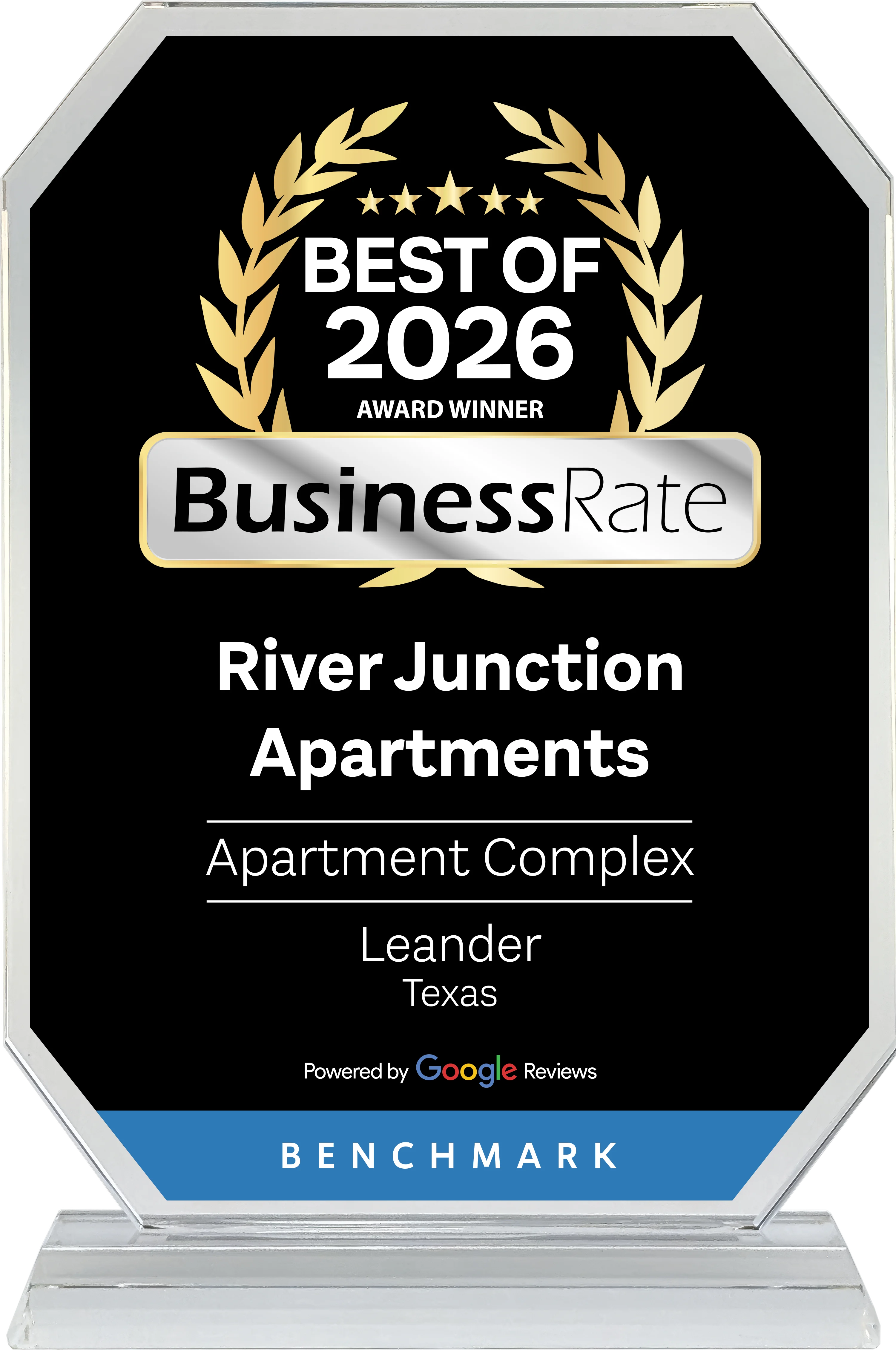 An award plaque featuring the text 'Best of 2026 Award Winner' at the top, with 'BusinessRate' prominently displayed. The award recognizes 'River Junction Apartments', an apartment complex located in Leander, Texas. The plaque is noted as 'Powered by Google Reviews' and is branded with 'Benchmark'.