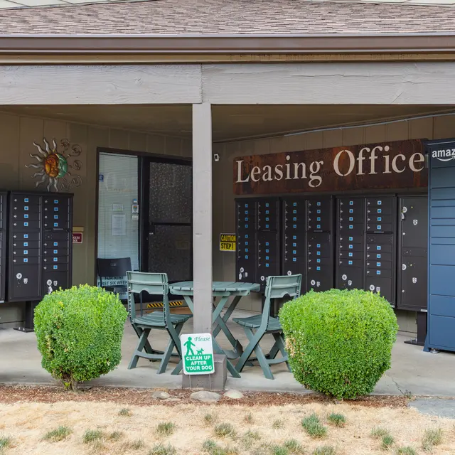 Leasing Office and Mail Services Exterior view of a leasing office featuring multiple mailboxes and an Amazon locker.
