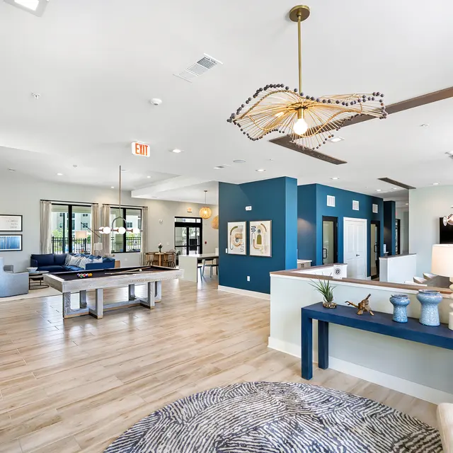 Modern Living Space Interior A spacious and modern interior of a living area featuring a dining table, comfortable seating, and decorative elements.
