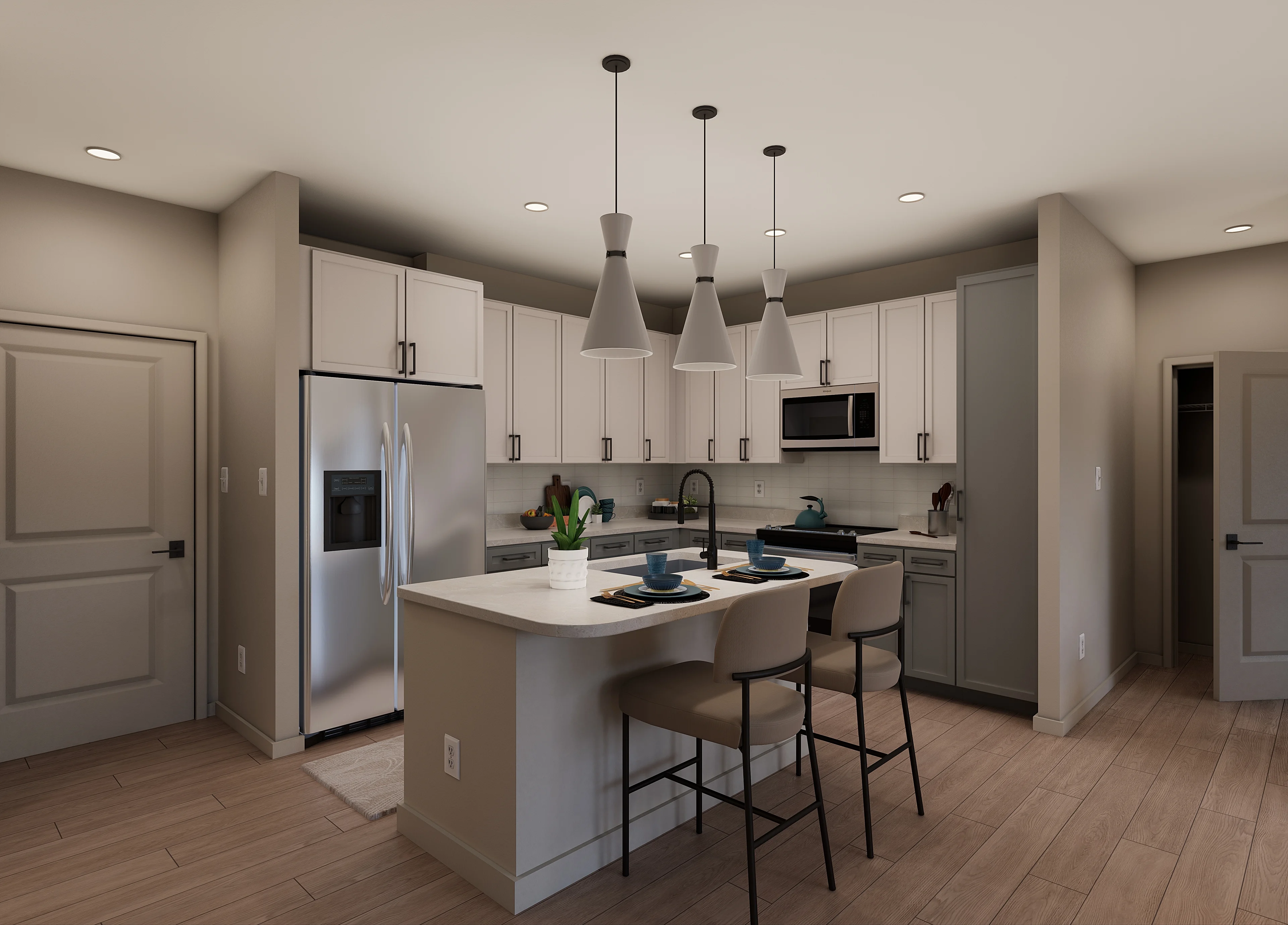 A modern kitchen featuring light-colored cabinets, stainless steel appliances, and pendant lighting over a kitchen island with two bar stools.