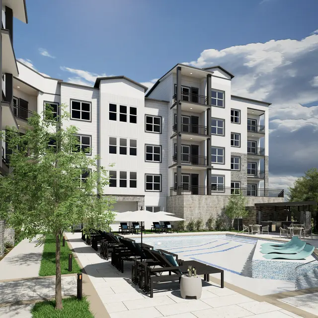 A modern apartment complex featuring a pool area with lounge chairs and umbrellas, surrounded by greenery and a spacious outdoor setting.