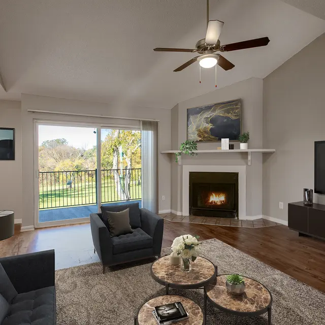 Living Room with Balcony at The Villas at Quail Creek Apartment Homes in Austin Texas 2024.jpg