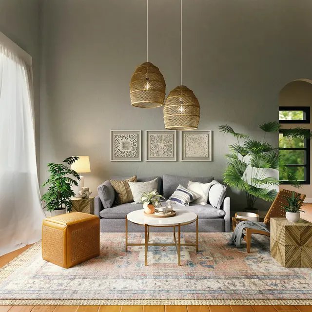 Cozy living room with a gray sofa, decorative art, plants, and pendant lights, featuring a warm, inviting atmosphere.