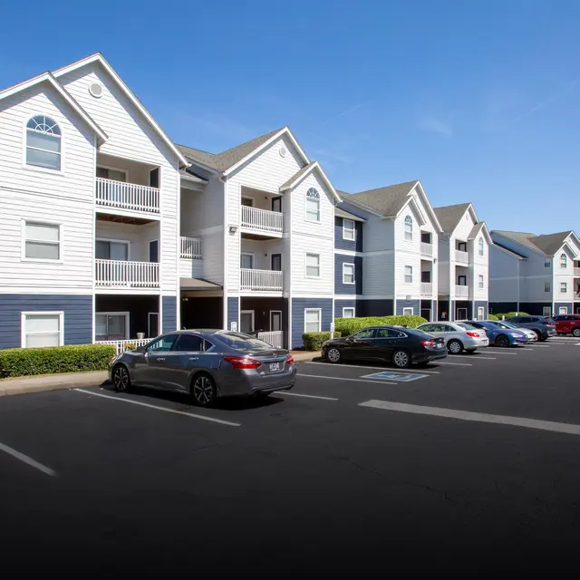 Exterior apartment buildings and community entrance at Centennial Crossing at Lenox Place