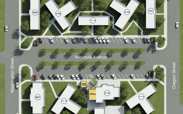 Aerial view of a site plan featuring various buildings arranged in a grid-like pattern. The plan includes labeled streets—Billings Avenue, Missoula Avenue, Oregon Street, and Butte Avenue—surrounded by parking areas and greenery.
