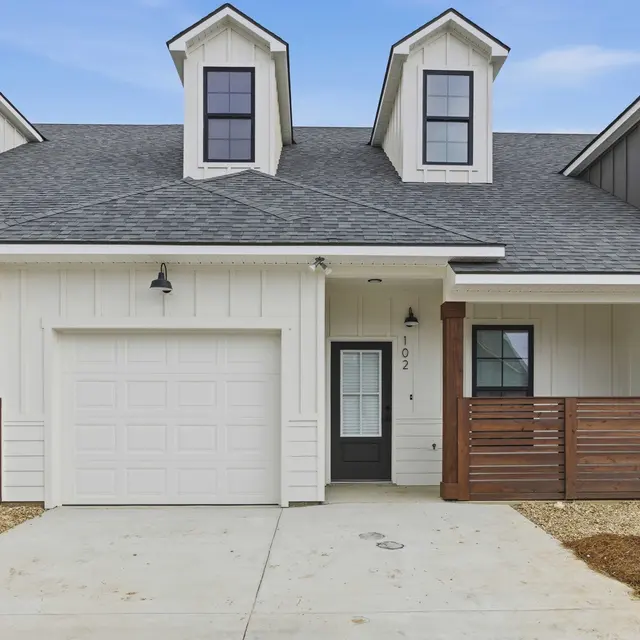 Modern Home Exterior Modern house exterior with two gabled roofs and a garage
