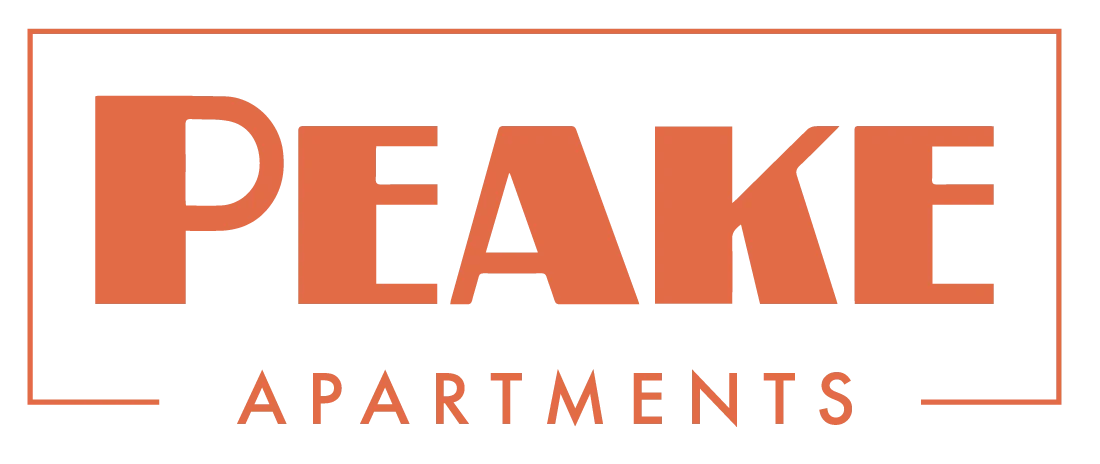 Peake Apartments Logo Logo for Peake Apartments featuring the word 'PEAKE' in bold and an orange color, with 'APARTMENTS' in smaller text below.