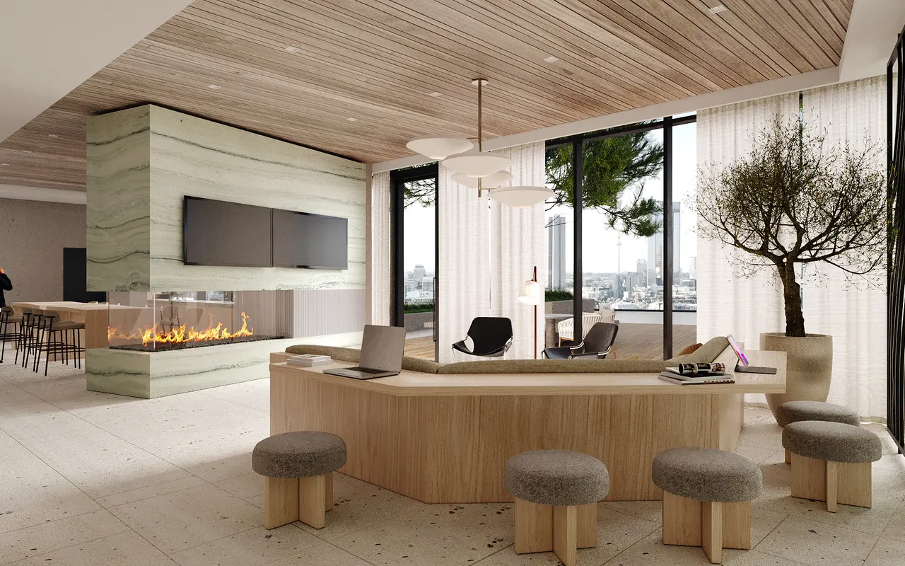 A modern lobby design featuring a wooden reception desk, circular stools, and large windows with a city view. A fireplace is integrated into the wall, and a decorative tree enhances the ambiance. There are bar stools in the background.