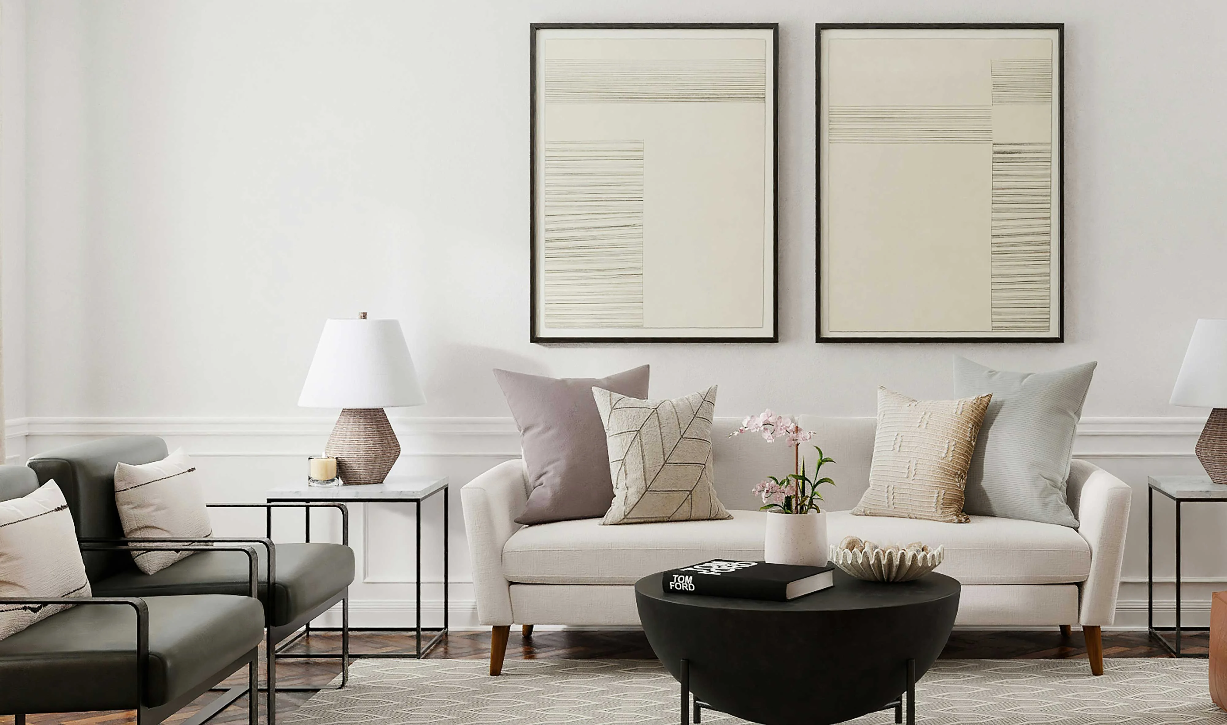 A modern living room featuring two abstract art pieces on the wall, a white sofa with assorted pastel pillows, a black coffee table, and stylish lamps.