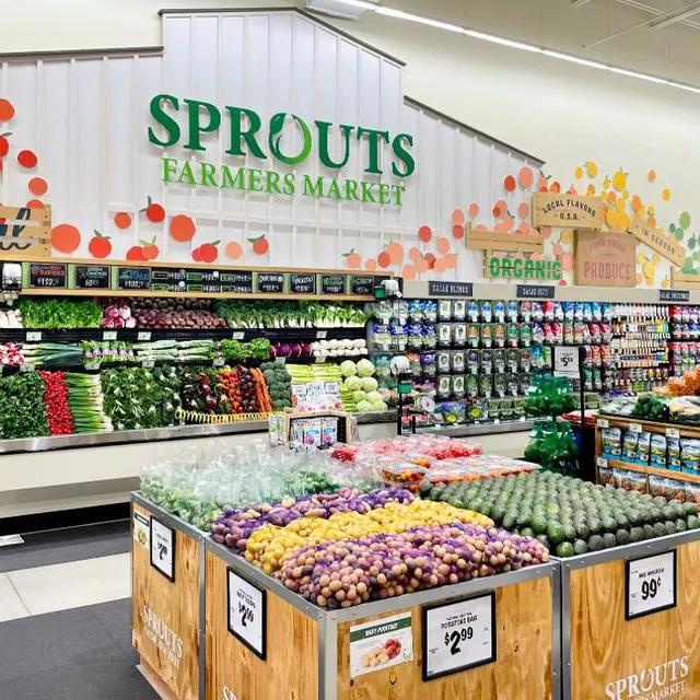 Interior view of a Sprouts Farmers Market displaying a variety of fresh vegetables and produce.