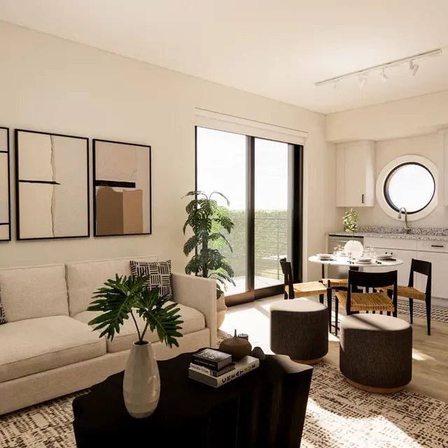 Stylish Modern Living Room A modern living room with a beige sofa, a round window, a small dining area, and stylish decor.