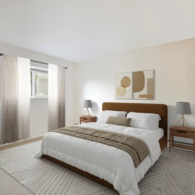 A modern bedroom featuring a brown upholstered bed, white bedding, two bedside tables with lamps, and large windows with sheer curtains. A green indoor plant is positioned by the wall on the left.