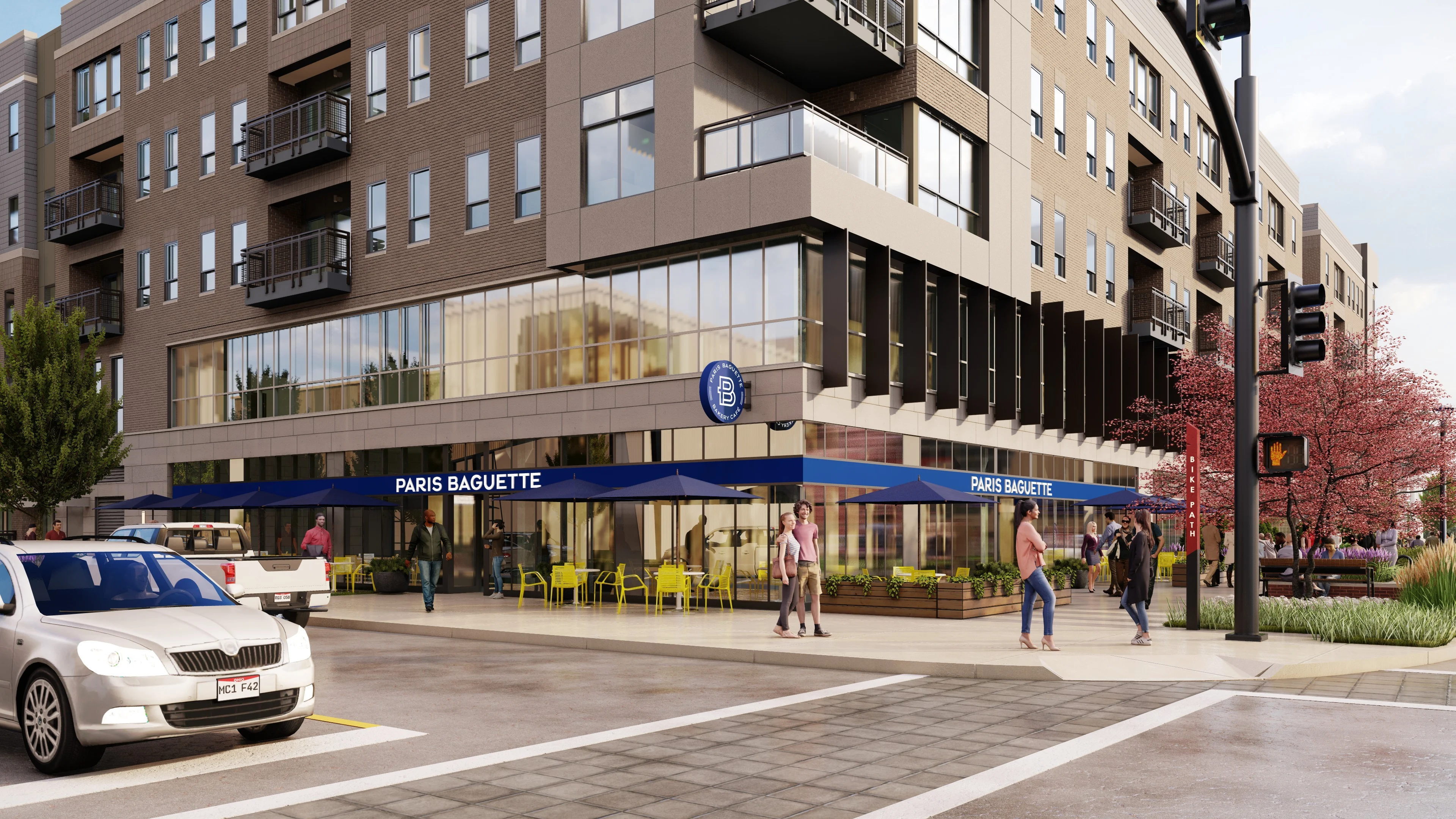 Paris Baguette Café Exterior An architectural rendering of a contemporary building featuring a cafe with outdoor seating, surrounded by pedestrians and trees.