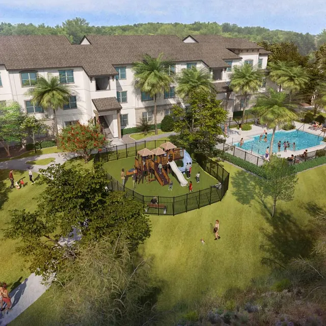 Aerial view of a modern apartment complex featuring a swimming pool and a playground, surrounded by lush greenery.