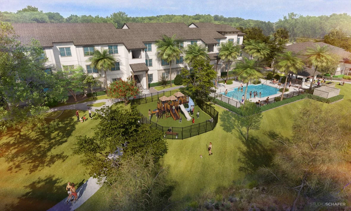 Aerial view of a modern apartment complex featuring a swimming pool and a playground, surrounded by lush greenery.