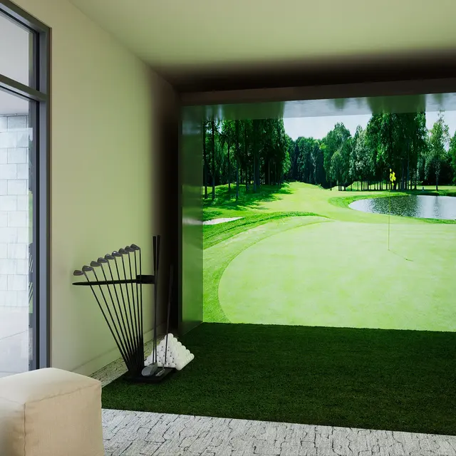An indoor golf simulator space featuring a large screen displaying a picturesque golf course, with artificial grass flooring and golf clubs neatly arranged next to it.