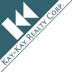 Logo of Kay-Kay Realty Corp featuring green triangular shapes and the company name.