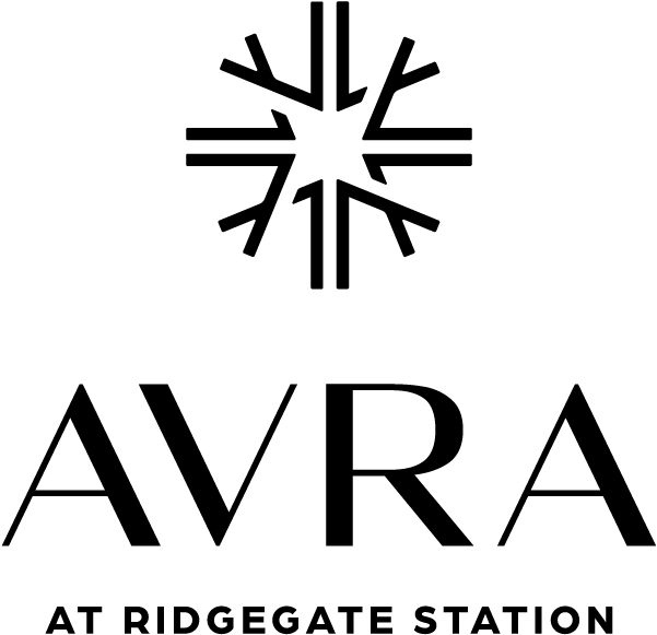 Logo for Avra at Ridgegate Station featuring stylized star-like emblem above the name 'AVRA' in bold lettering.