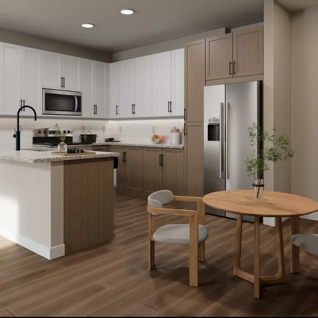 A modern kitchen with white upper cabinets, wooden lower cabinets, and stainless steel appliances. A small round wooden dining table is set in the foreground with four chairs. The kitchen features granite countertops and a sleek design.