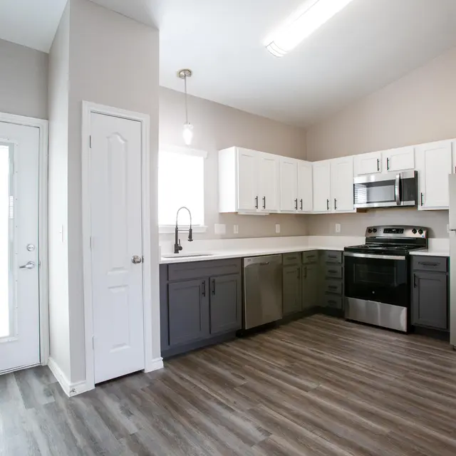 Willow 2x2 apartment homes featuring open-concept living spaces, modern kitchens, spacious bedrooms, and covered parking in a professionally maintained community