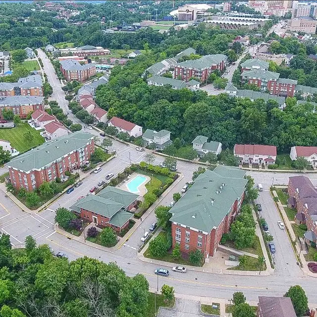Aerial View of Suburban Neighborhood Aerial view of a residential area with buildings and greenery.