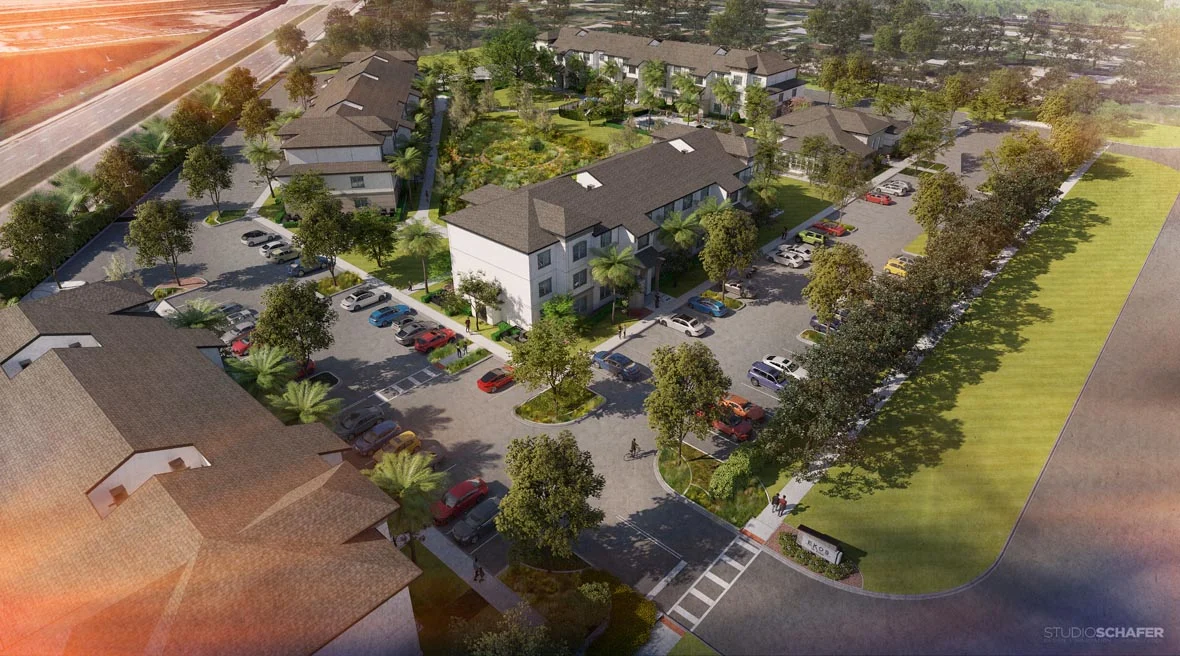 New Residential Development Aerial View Aerial view of a new residential development featuring multiple buildings, parking spaces, and landscaped areas.