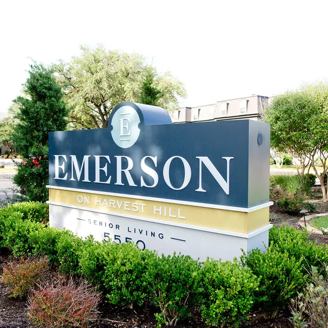 Signage for Emerson on Harvest Hill, a senior living community, displaying the name and address.