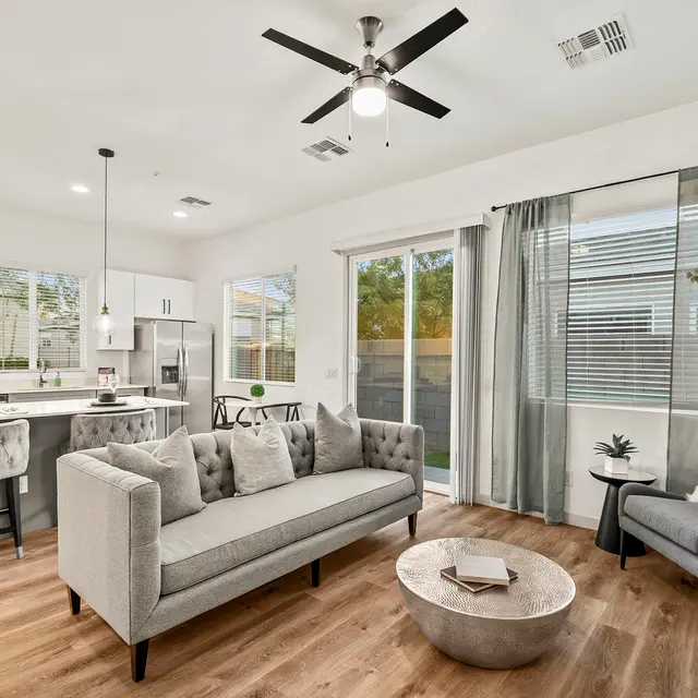 Bright open-concept living room with modern finishes at The Farmhouse on Estrella