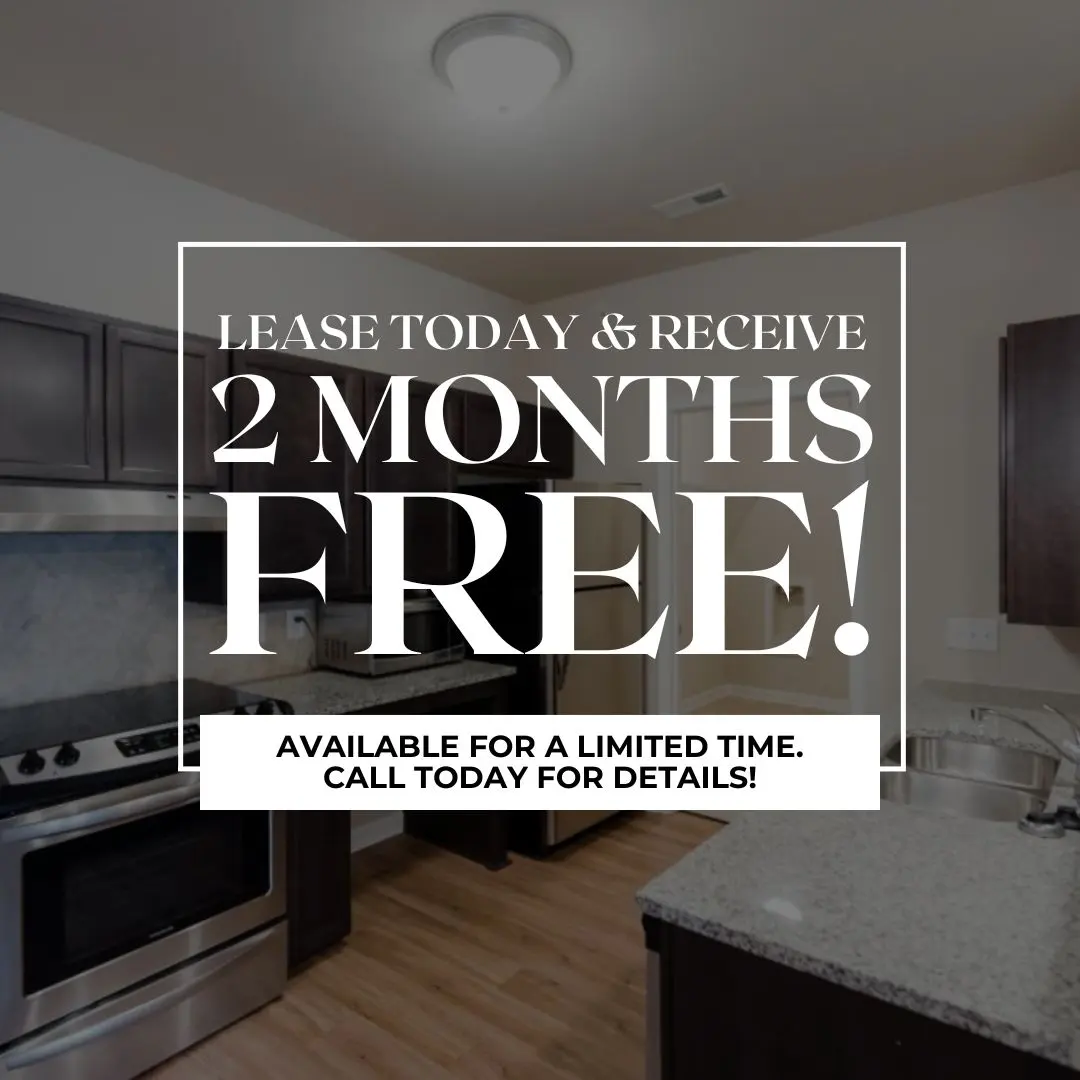 Apartment Leasing Offer An advertisement for an apartment lease with text promoting 2 months free rent. The background features a modern kitchen with stainless steel appliances and granite countertops.