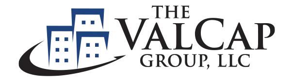 Logo of The ValCap Group, LLC featuring buildings and stylized text.