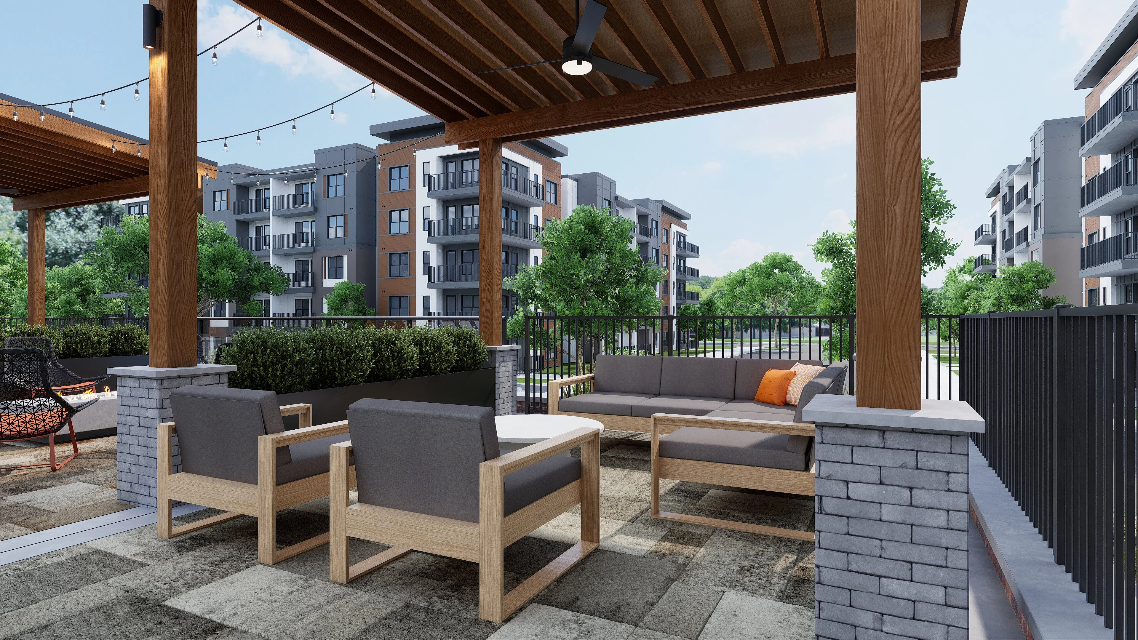 Outdoor Terrace in Modern Apartment Complex Outdoor seating area with modern furniture surrounded by greenery and apartment buildings in the background.