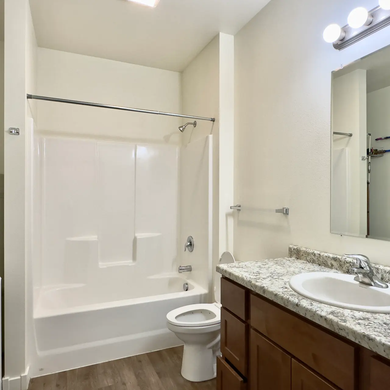 apartment bath room Undecorated bathroom in an apartment, featuring basic fixtures and clean design
