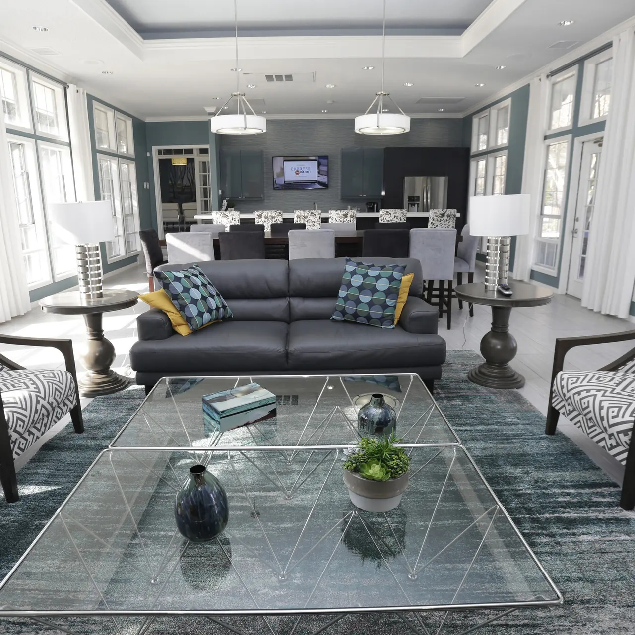 open commons space with furniture, dining room table and kitchen