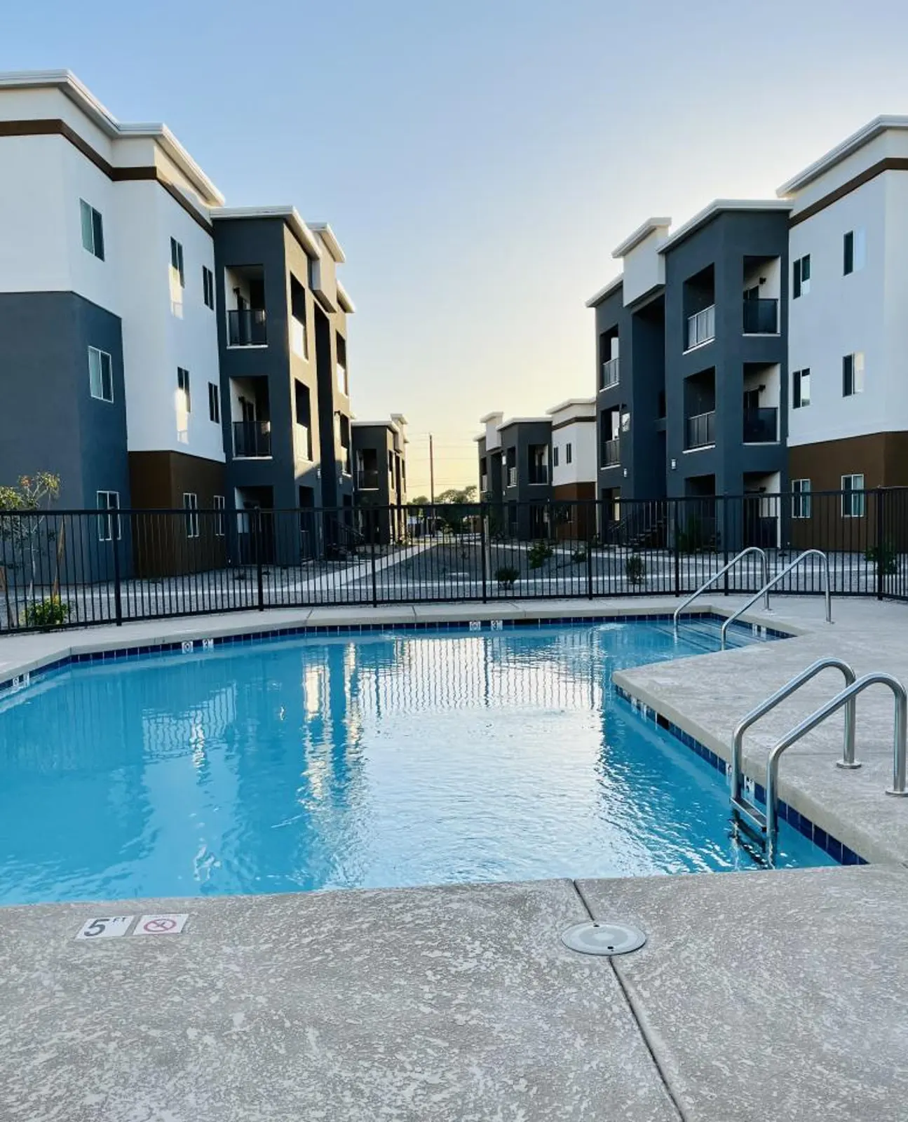 Pool entry rails and apartment buildings.