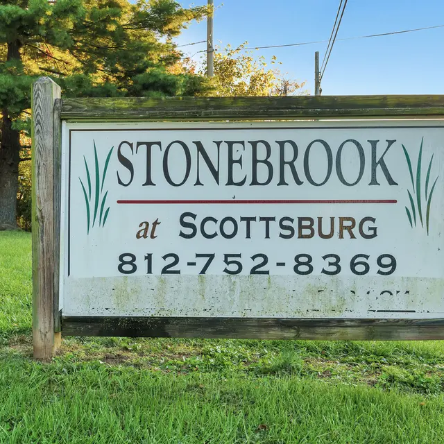 Sign for Stonebrook at Scottsburg displaying contact number and location.