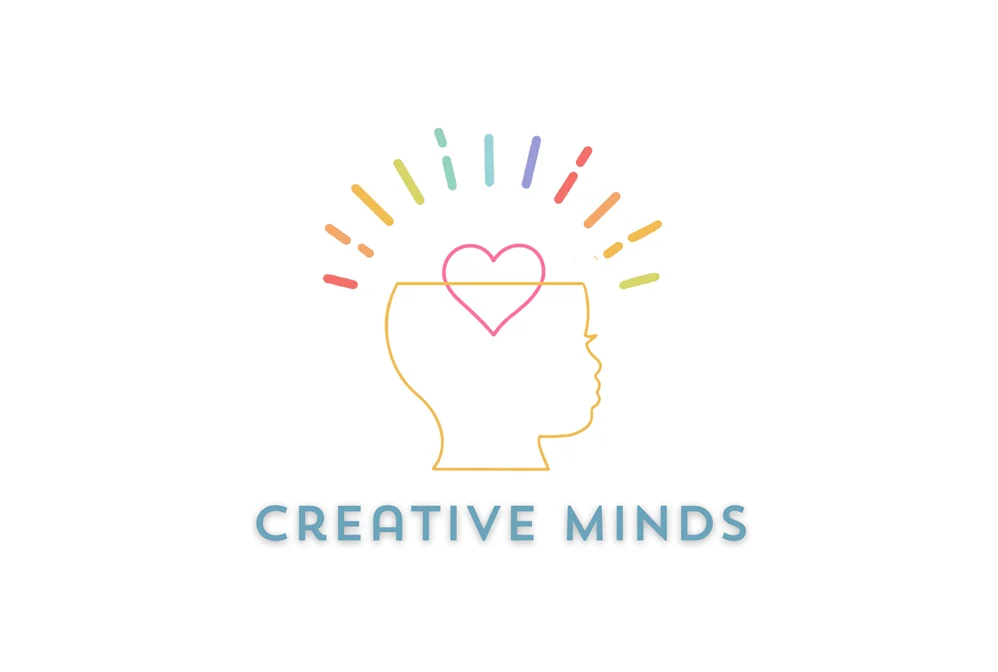 A logo depicting a profile silhouette of a child's head with a heart symbol and colorful rays emanating from it, with the text 'Creative Minds' below.