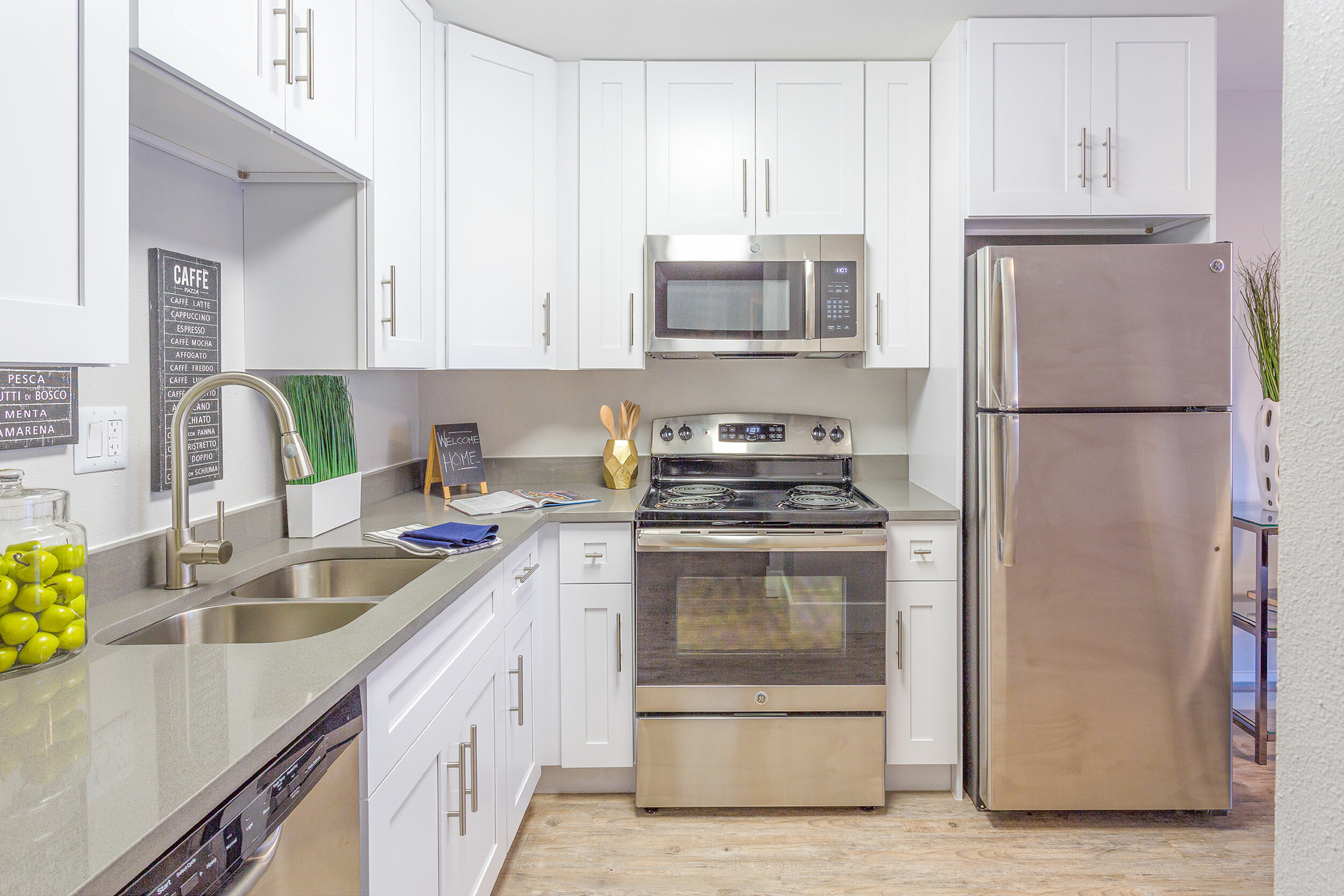 Modern Kitchen Design Modern kitchen with stainless steel appliances and white cabinetry