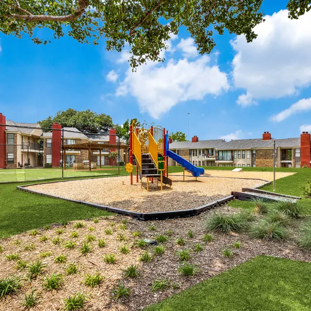 Playground, corn hole, and play area at North Star apartments in Dallas, TX
