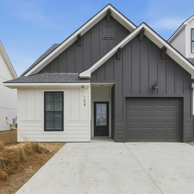 Modern Two-Tone House Exterior Front view of a modern two-tone house with a garage.